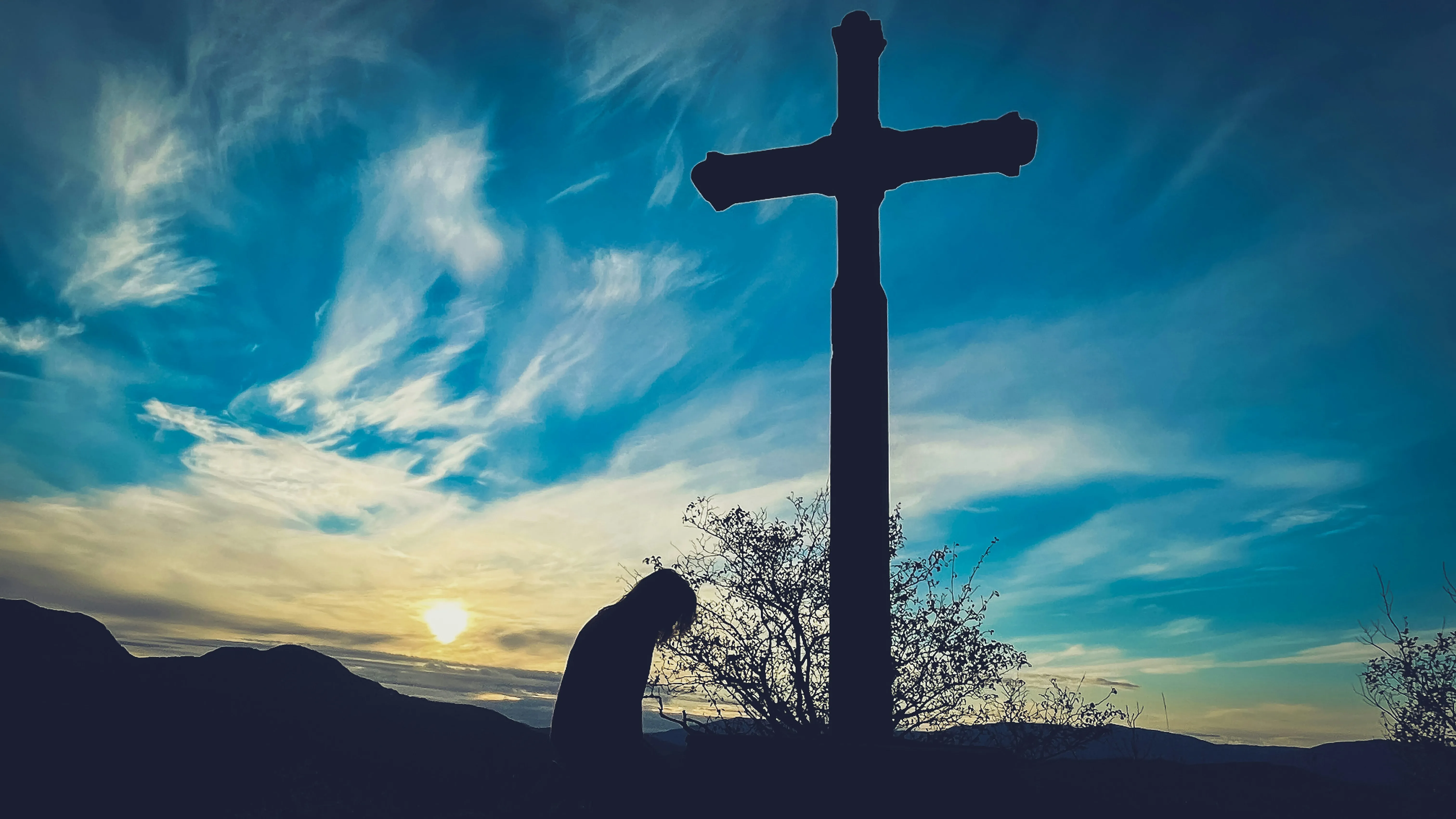 Pray in front of cross
